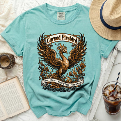 Teal Comfort Colors t-shirt with a phoenix graphic and text "Cursed Firebird Vassa - Queen - Bound at Dusk - Free at Dawn".