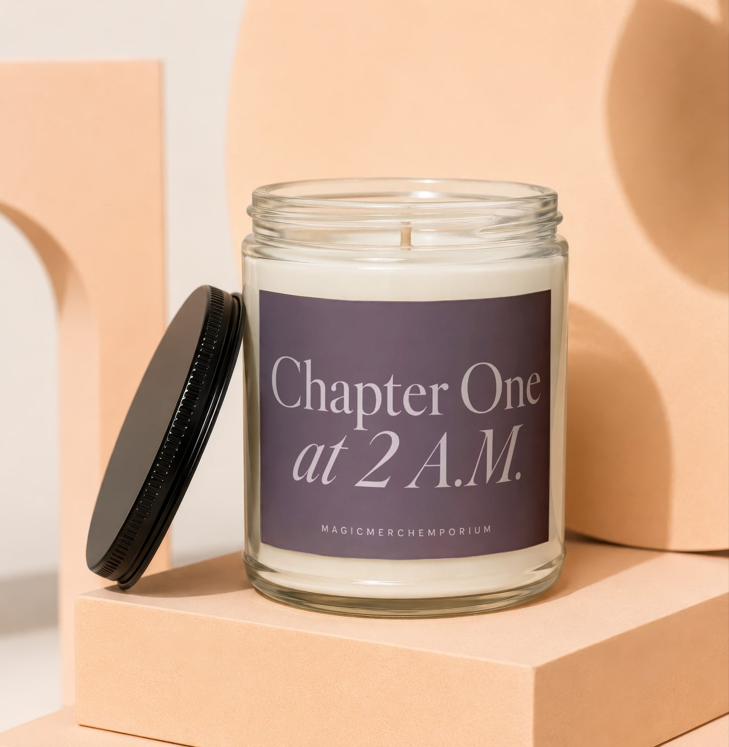 Glass jar candle with "Chapter One at 2 A.M." label and black lid.