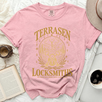 Pink Comfort Colors t-shirt with gold "Terrasen Locksmiths" graphic and slogan.