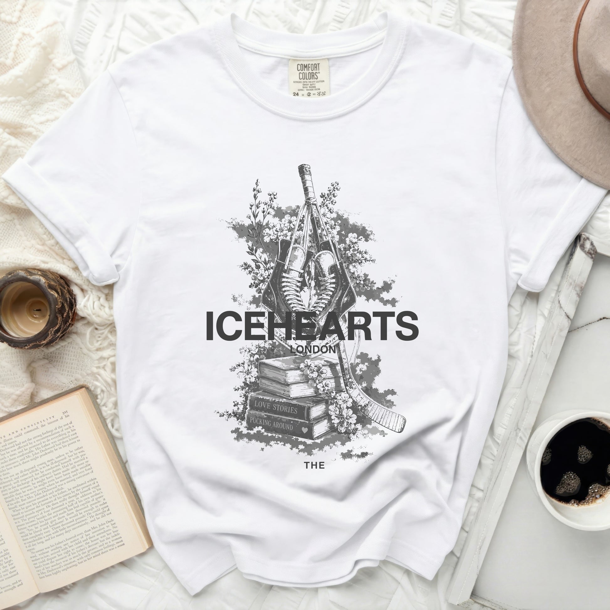 White t-shirt with "ICEHEARTS LONDON" and hockey stick and skates graphic.