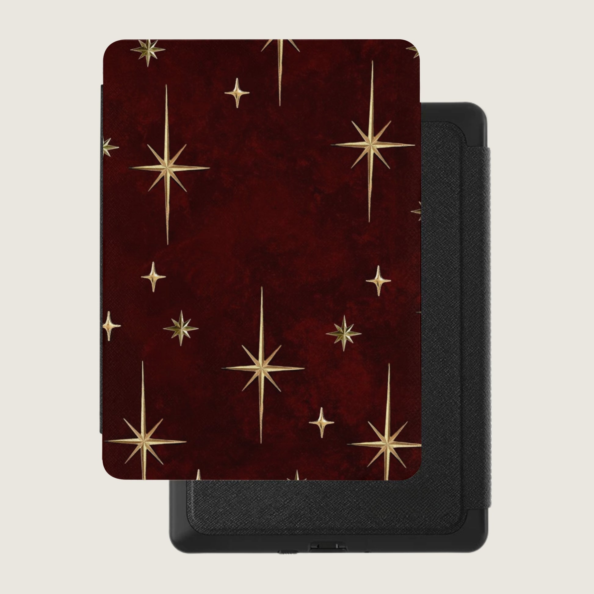 Red case with gold starburst pattern on a black device with textured finish.