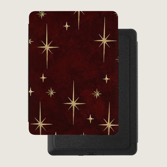 Red case with gold starburst pattern on a black device with textured finish.