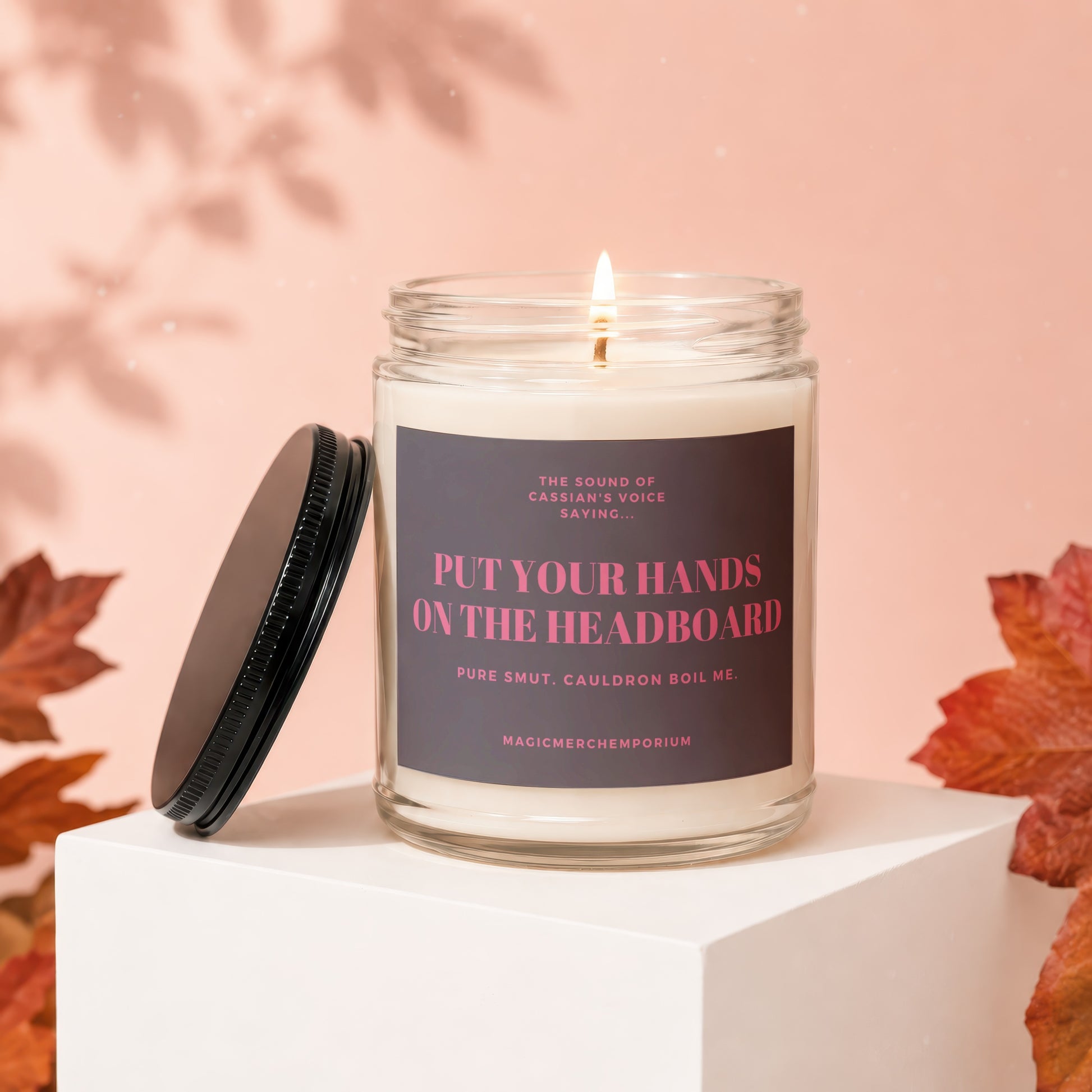 Candle with text "Put Your Hands on the Headboard" and "Pure Smut. Cauldron Boil Me.".