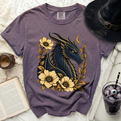 Purple t-shirt with a dark blue dragon, yellow flowers, and a crescent moon.