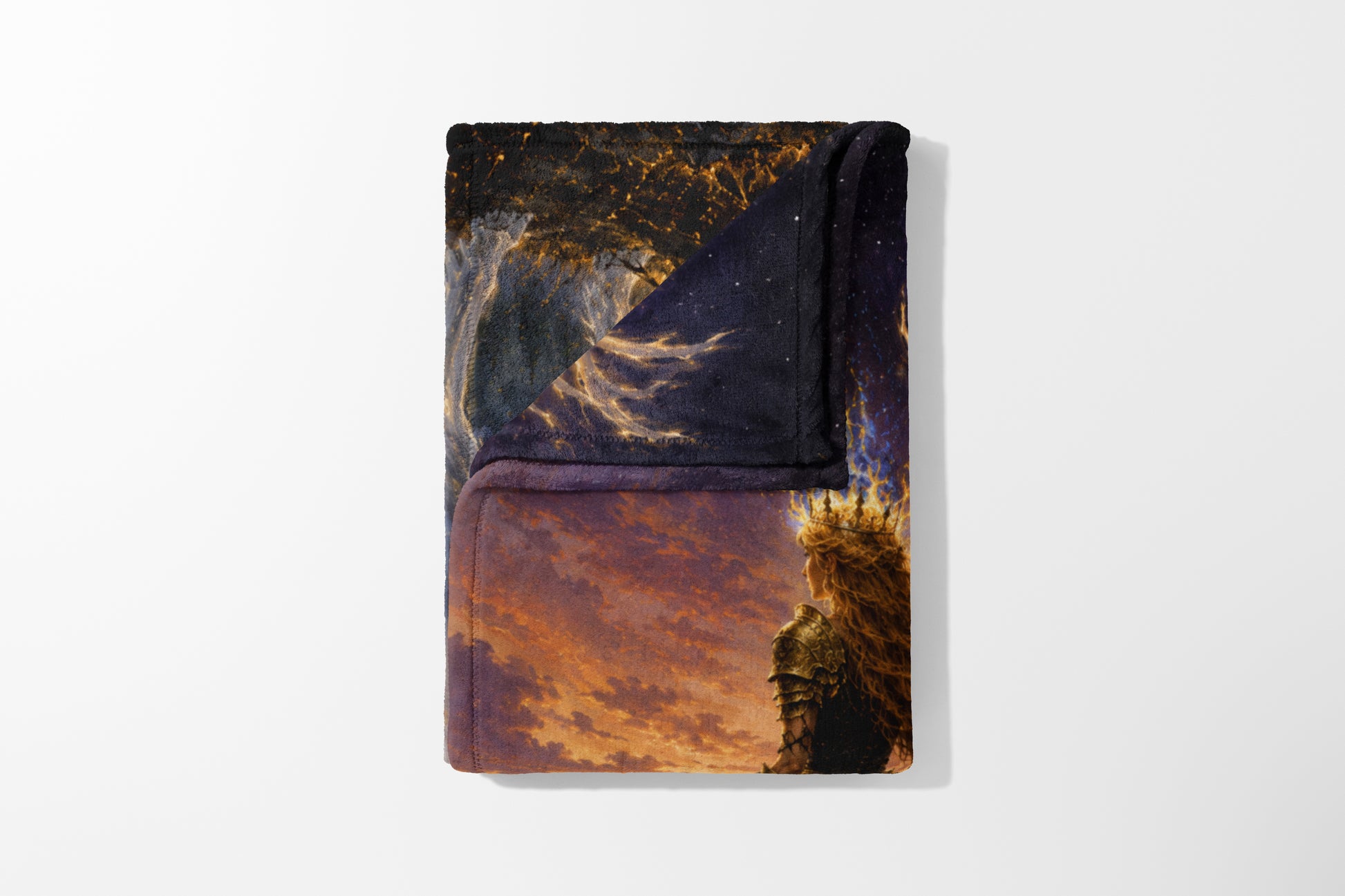 Folded blanket with artwork of a crowned warrior against a fiery sky and starry background.