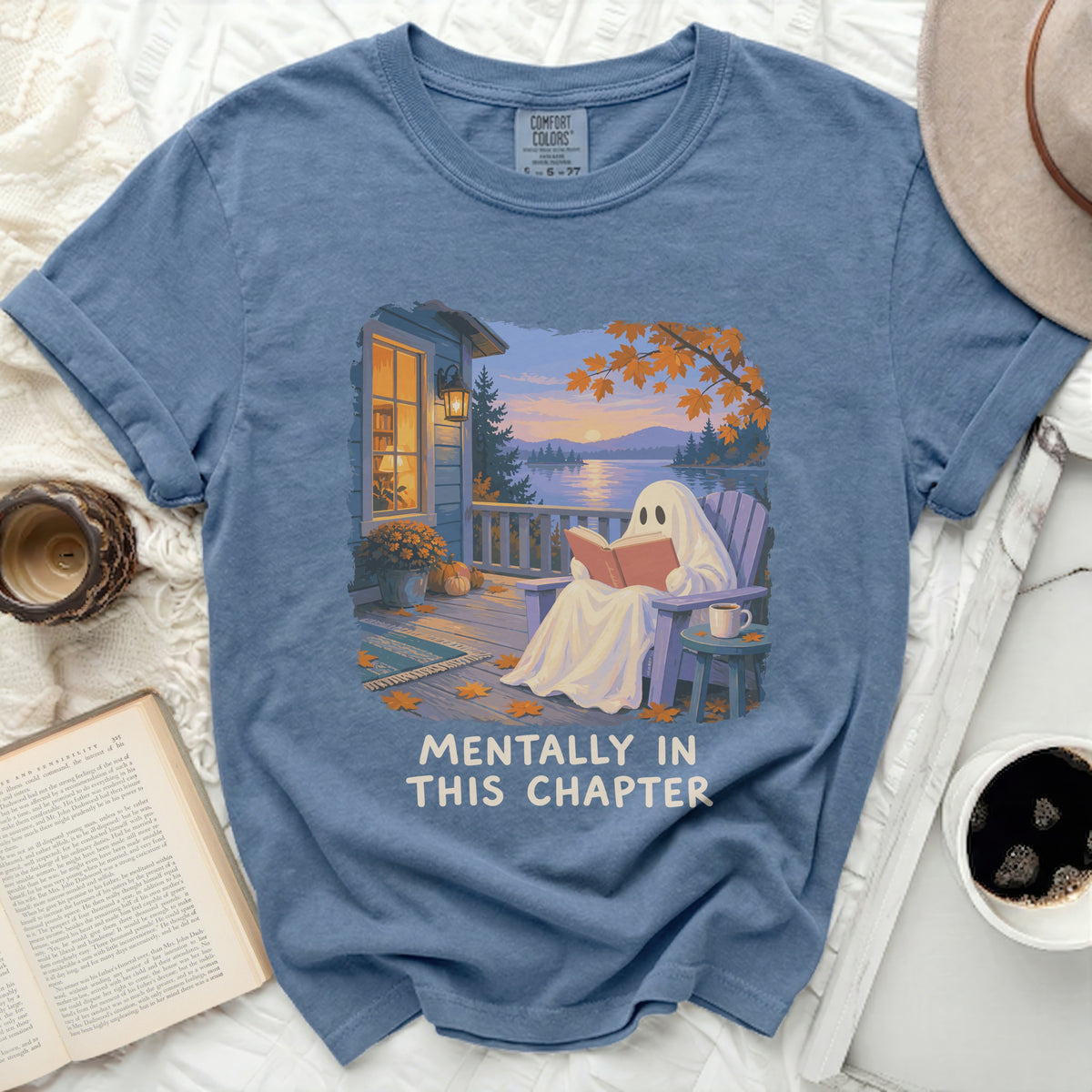 Ghost reading a book on a porch with text "MENTALLY IN THIS CHAPTER".