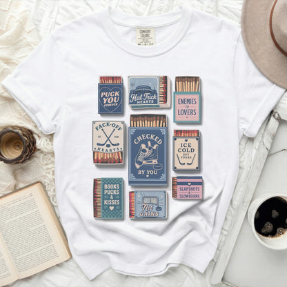 White t-shirt with vintage matchbook graphics for hockey puns.