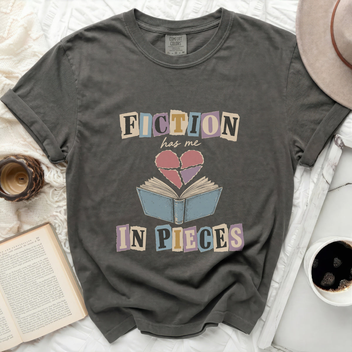 Dark grey t-shirt with "FICTION has me IN PIECES" graphic.