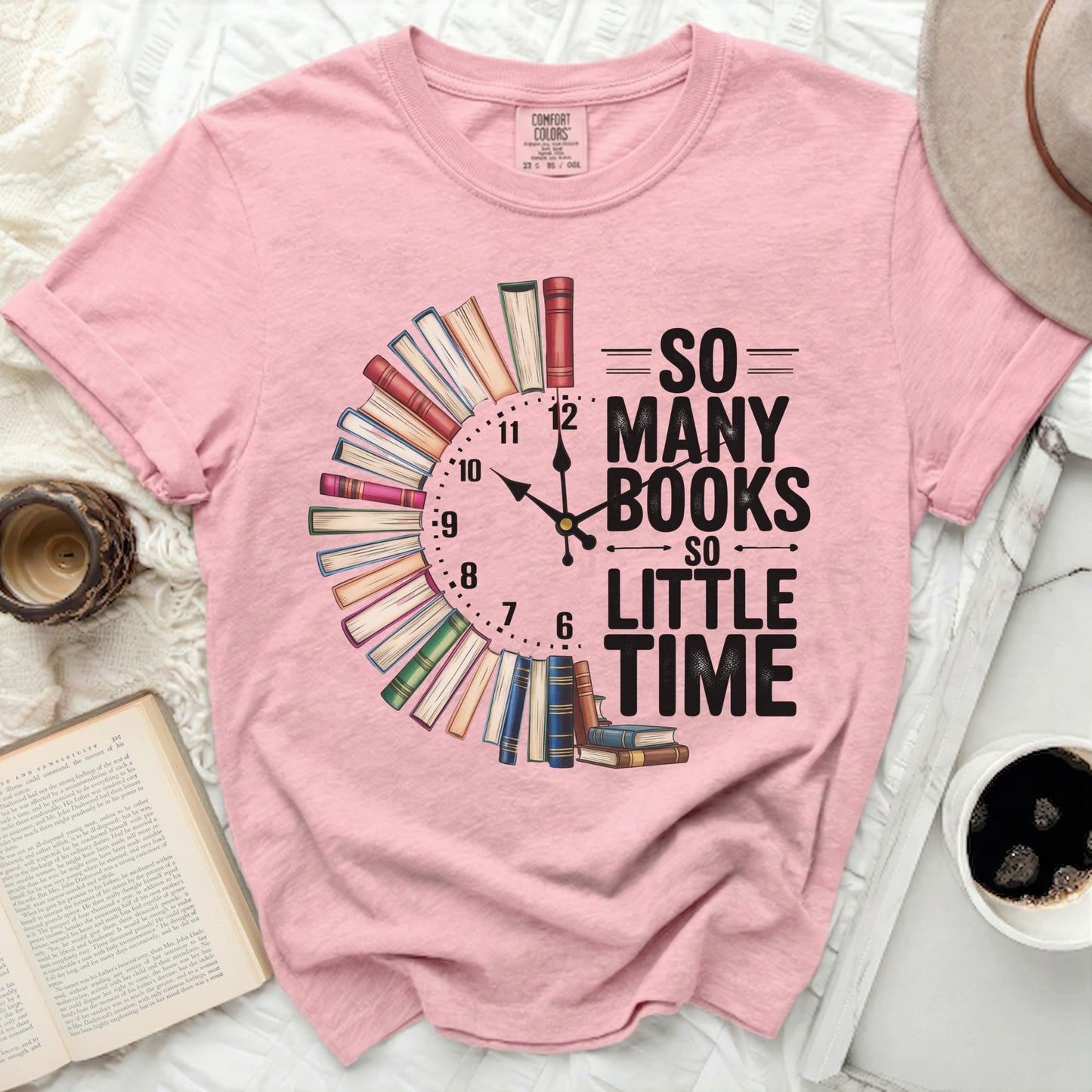 Pink t-shirt with "So Many Books So Little Time" text and clock design.