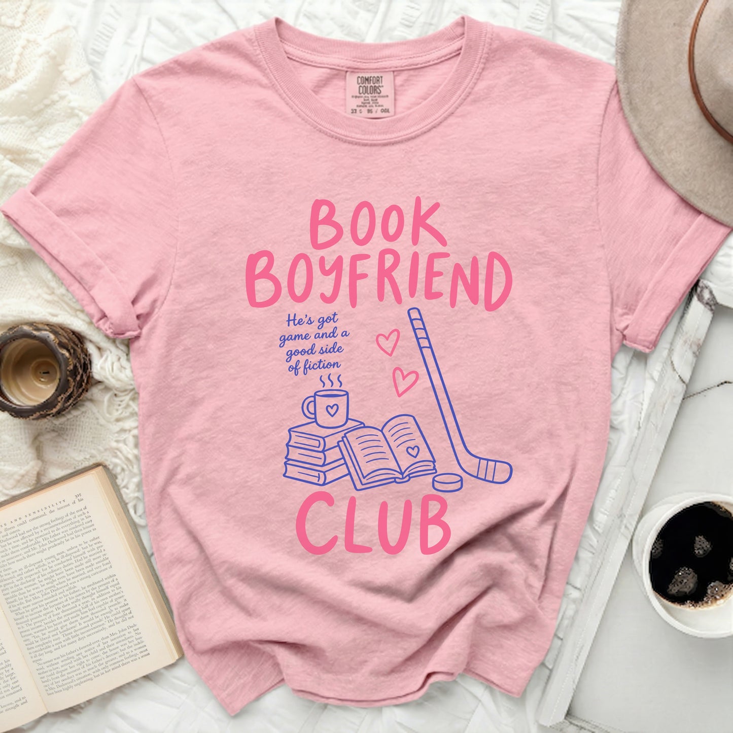 Comfort Colors t-shirt with "Book Boyfriend Club" graphic and hockey stick.