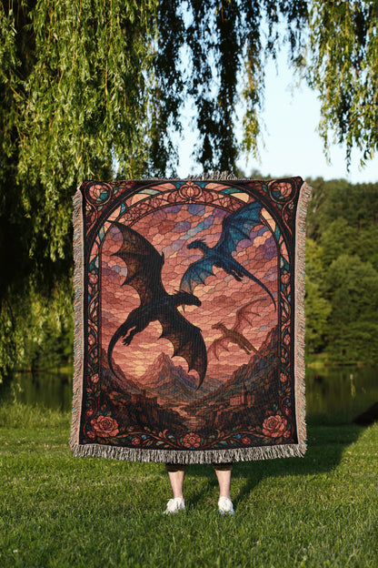 A person is standing in a grassy area, holding a large, colorful tapestry featuring a dragon design. The tapestry is framed by a decorative border and is displayed in front of the person.