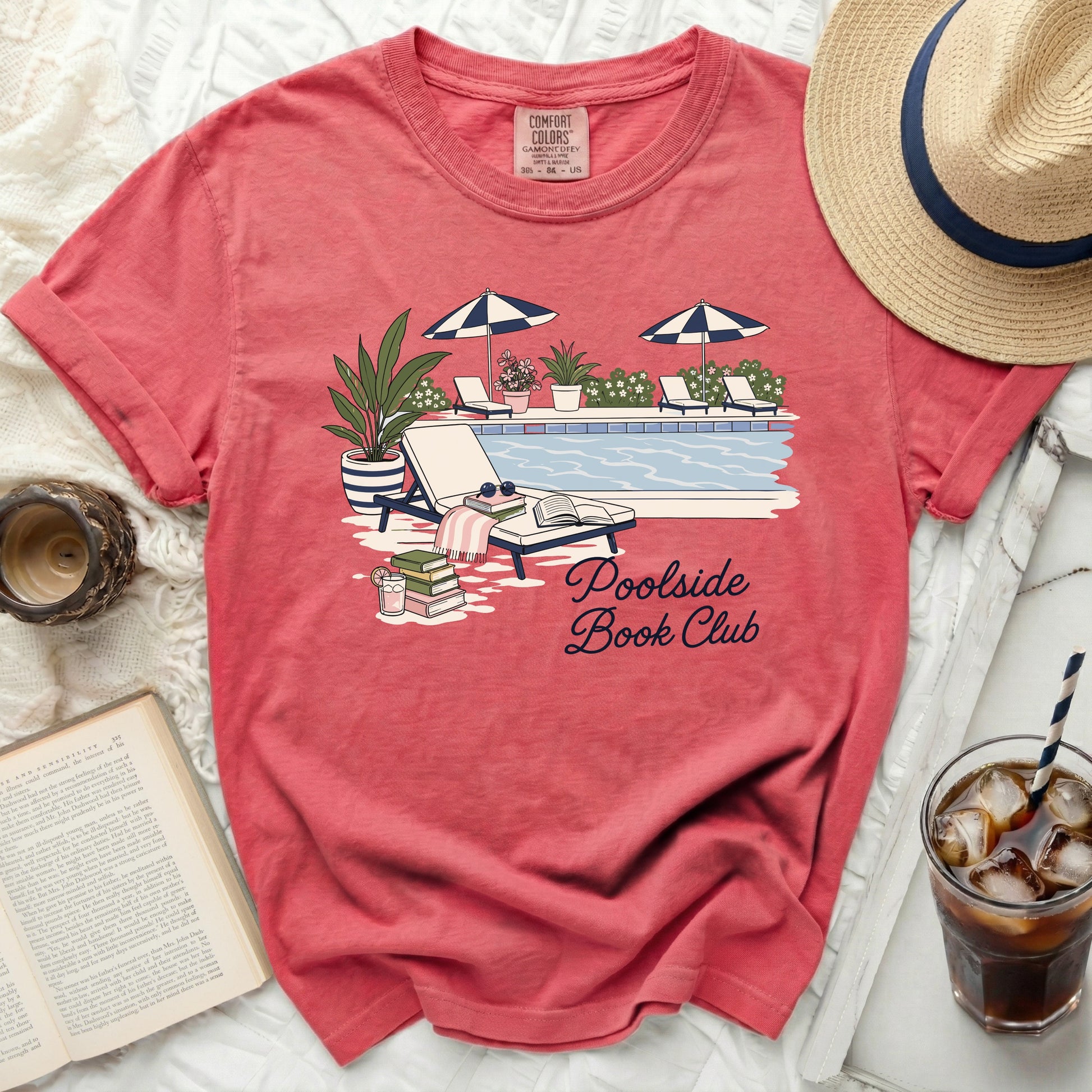 T-shirt with "Poolside Book Club" text and poolside illustration.