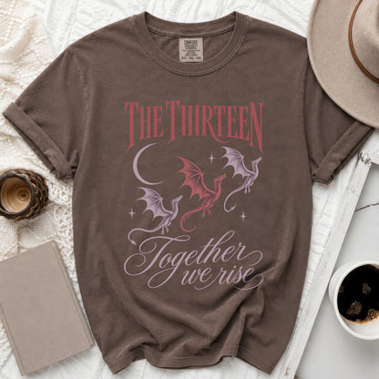 Brown t-shirt with "The Thirteen" text, dragons, and "Together we rise" quote.