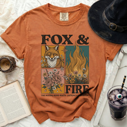Orange t-shirt with "FOX & FIRE" graphic featuring a fox, flames, and flowers.