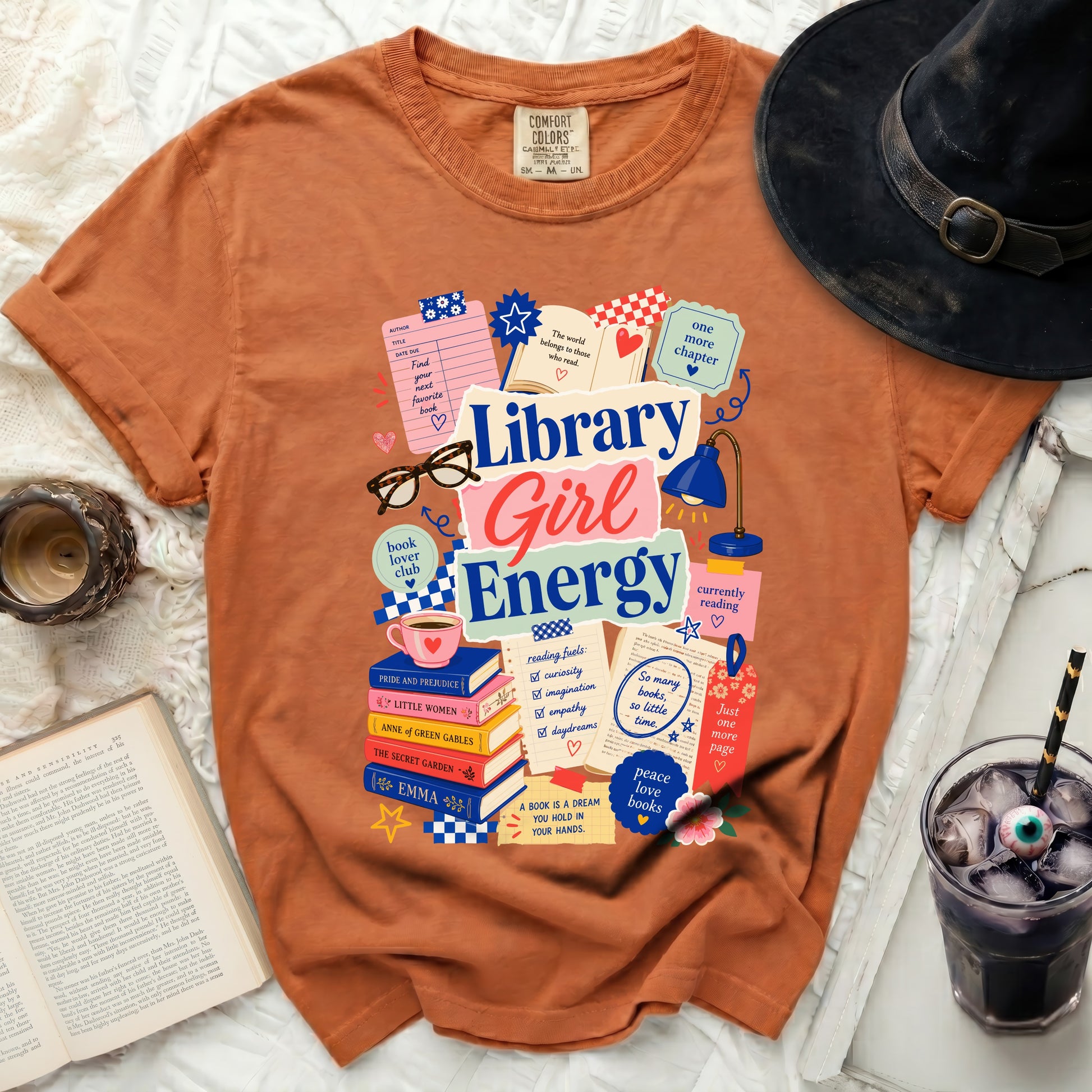 Orange t-shirt with "Library Girl Energy" graphic, books, and reading quotes.