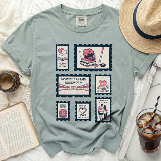 T-shirt with stamps featuring hockey imagery and "Grumpy Captain Bookworm" text.