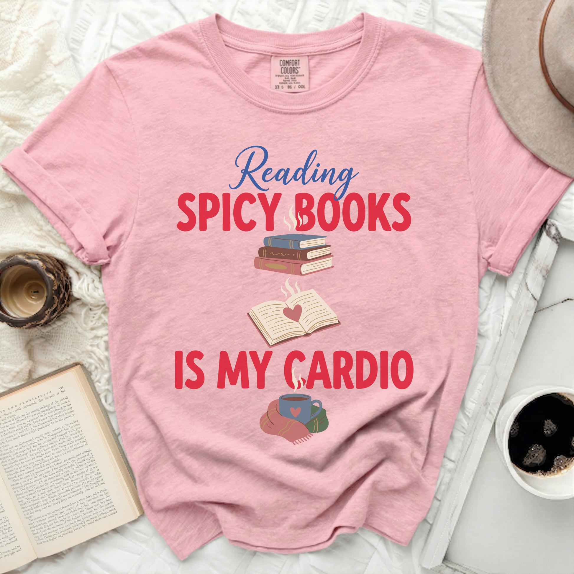 Pink t-shirt with "Reading SPICY BOOKS IS MY CARDIO" text and illustrations.