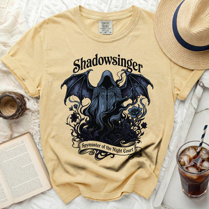 Yellow Comfort Colors t-shirt with "Shadowsinger Spymaster of the Night Court" graphic.