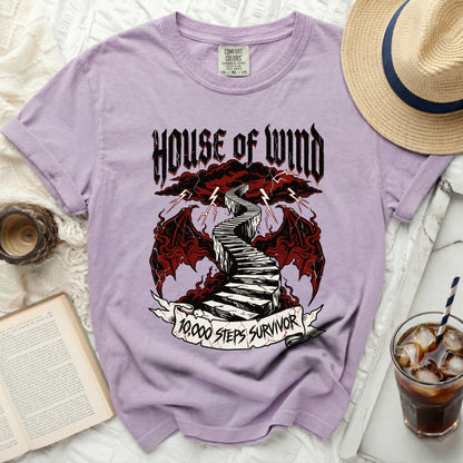 Purple t-shirt with "HOUSE OF WIND 10,000 STEPS SURVIVOR" graphic.
