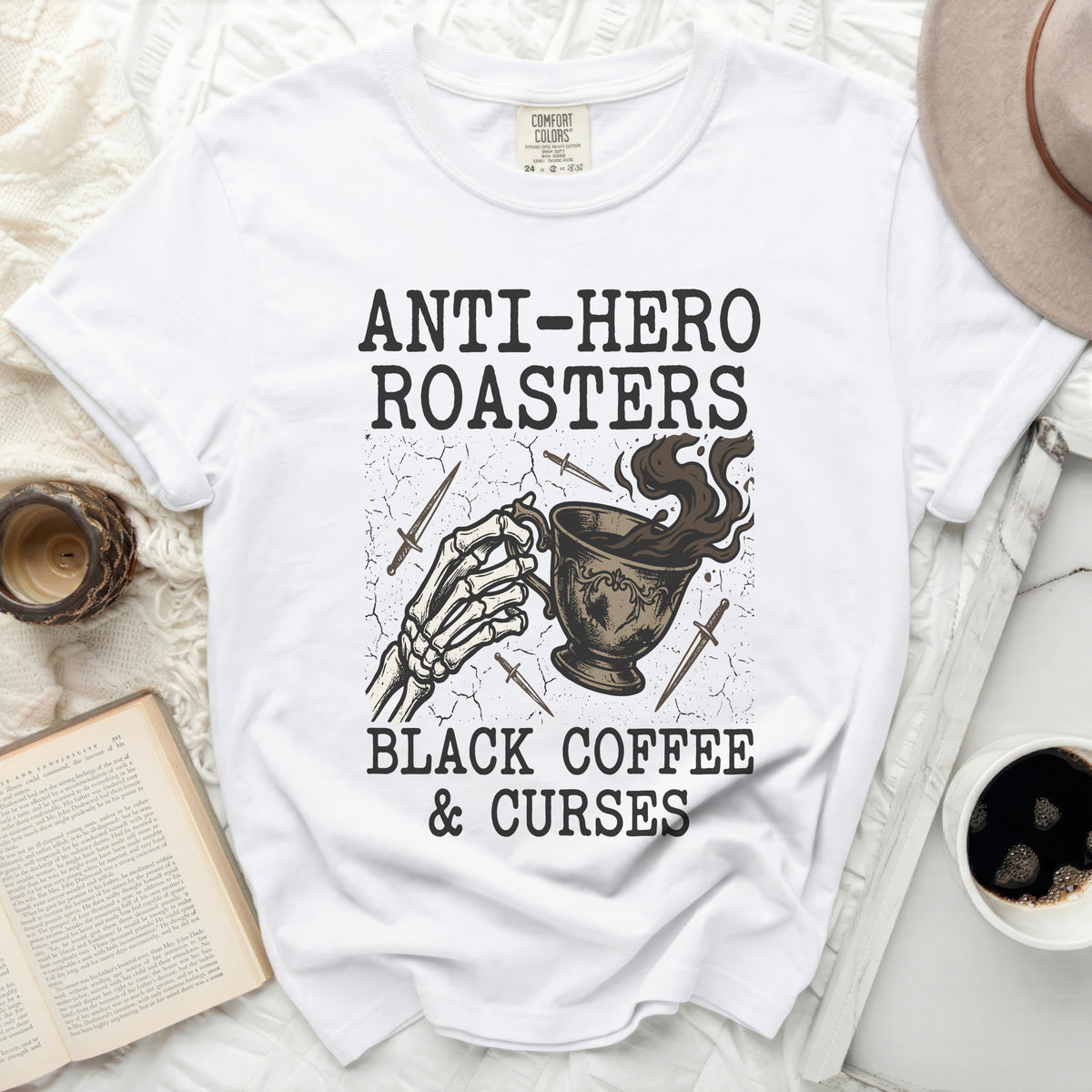 White t-shirt with "Anti-Hero Roasters Black Coffee & Curses" graphic.