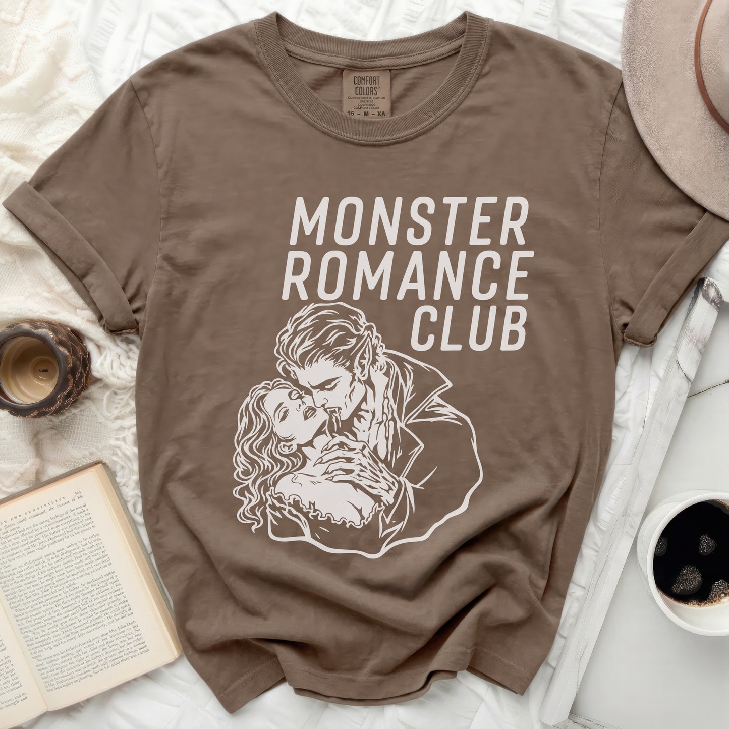 Brown t-shirt with "MONSTER ROMANCE CLUB" in white gothic font.