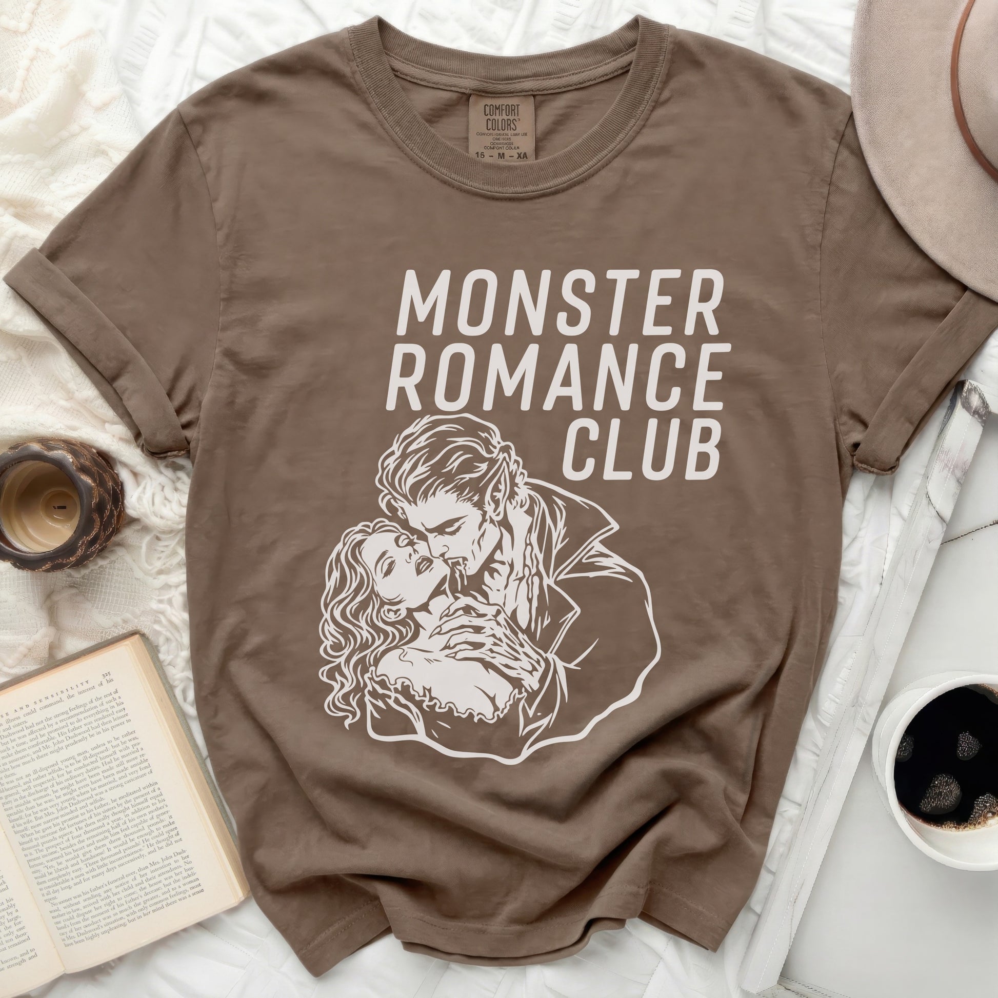 Brown t-shirt with "MONSTER ROMANCE CLUB" in white gothic font.