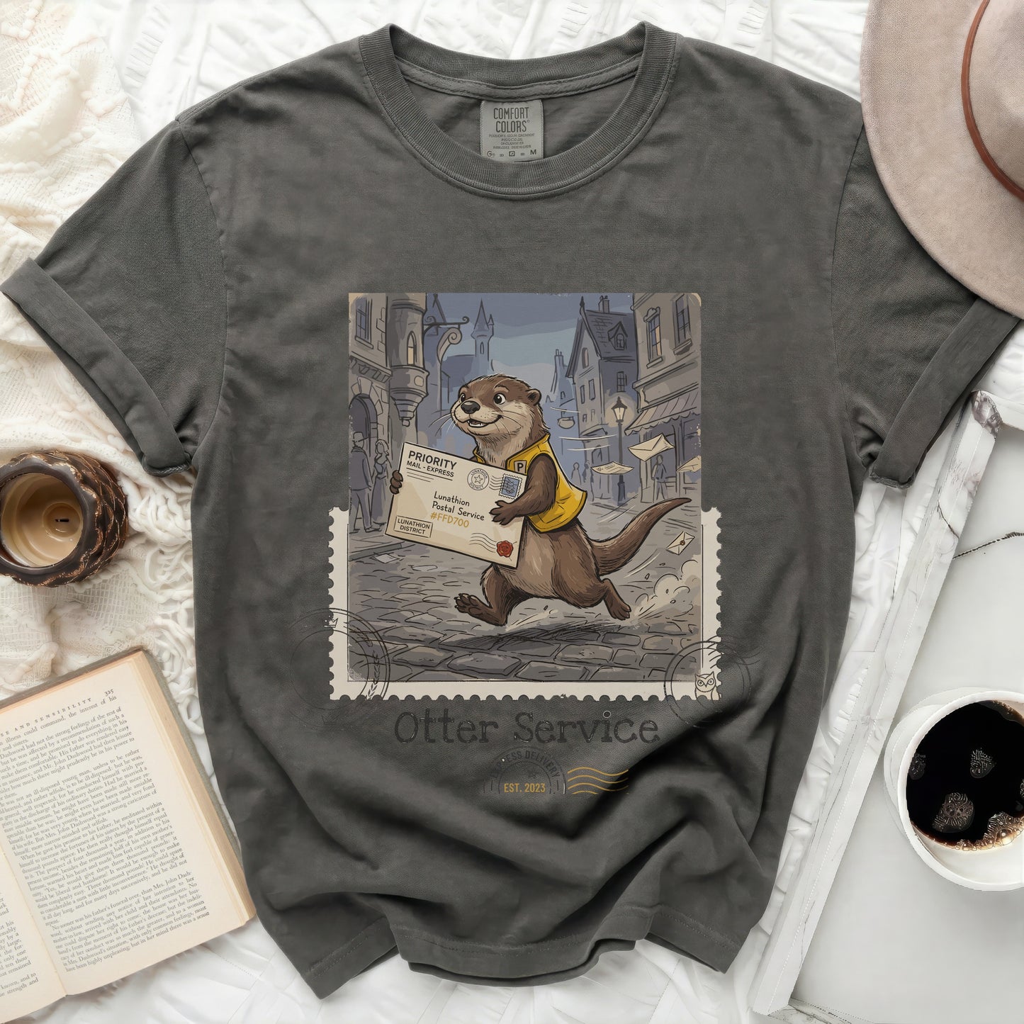T-shirt with an otter in a yellow vest delivering mail, "Otter Service" logo.