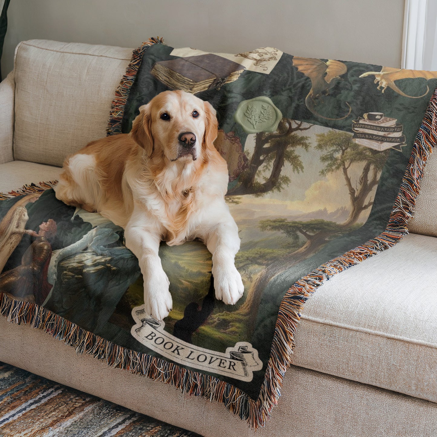 A golden retriever dog is lying on a couch with a green and brown blanket featuring a landscape scene and the text "BOOK LOVER".