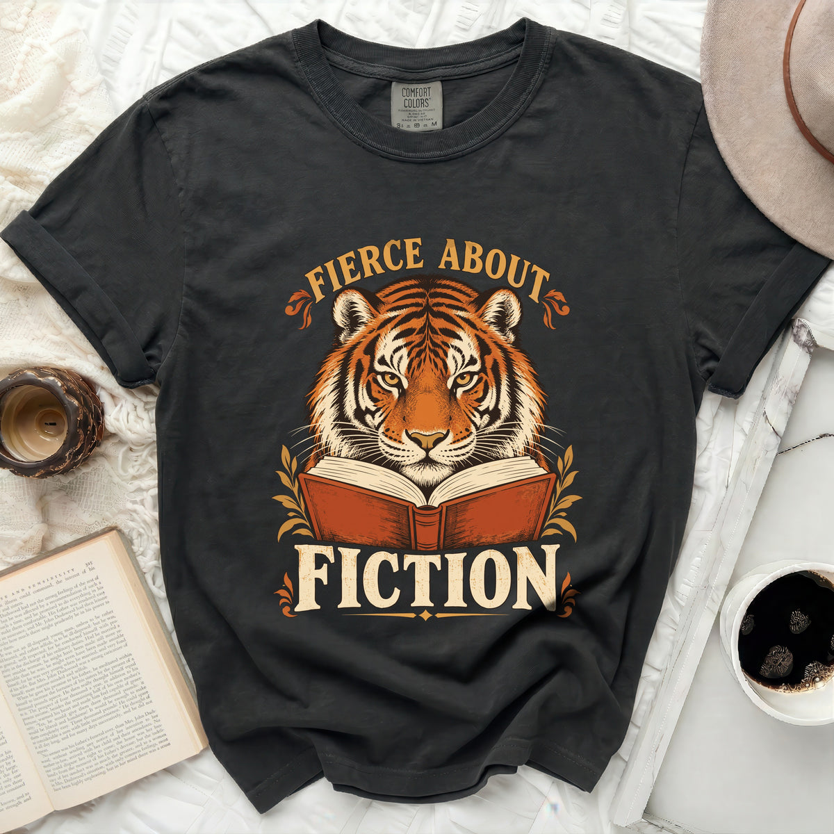 Black t-shirt with tiger, open book, and text "Fierce About Fiction".