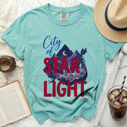 Teal t-shirt with "City of Star Light" graphic and dragon silhouette.