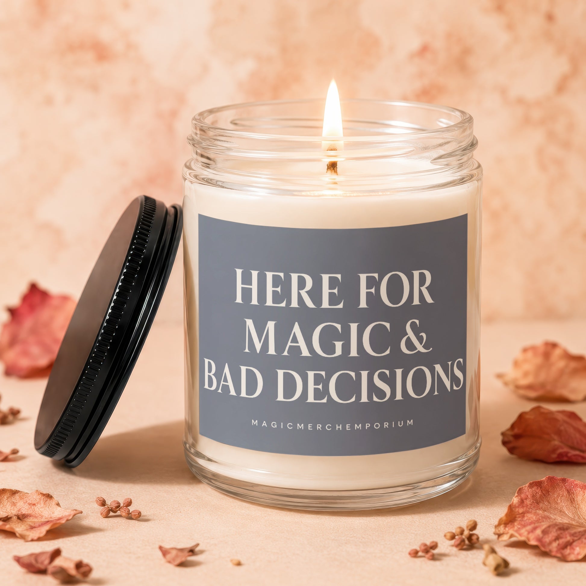 Candle in a glass jar with lit wick and lid askew, reading "HERE FOR MAGIC & BAD DECISIONS".