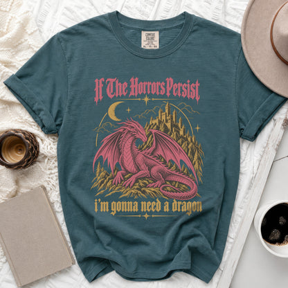 Teal t-shirt with a pink dragon and castle graphic that reads "If The Horrors Persist i'm gonna need a dragon".