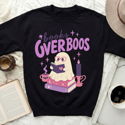 Black sweatshirt with ghost reading "books OVER BOOS" and pink candle.