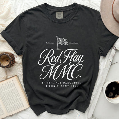 Black t-shirt with "Red Flag MMC. If He's Not Dangerous I Don't Want Him." text.