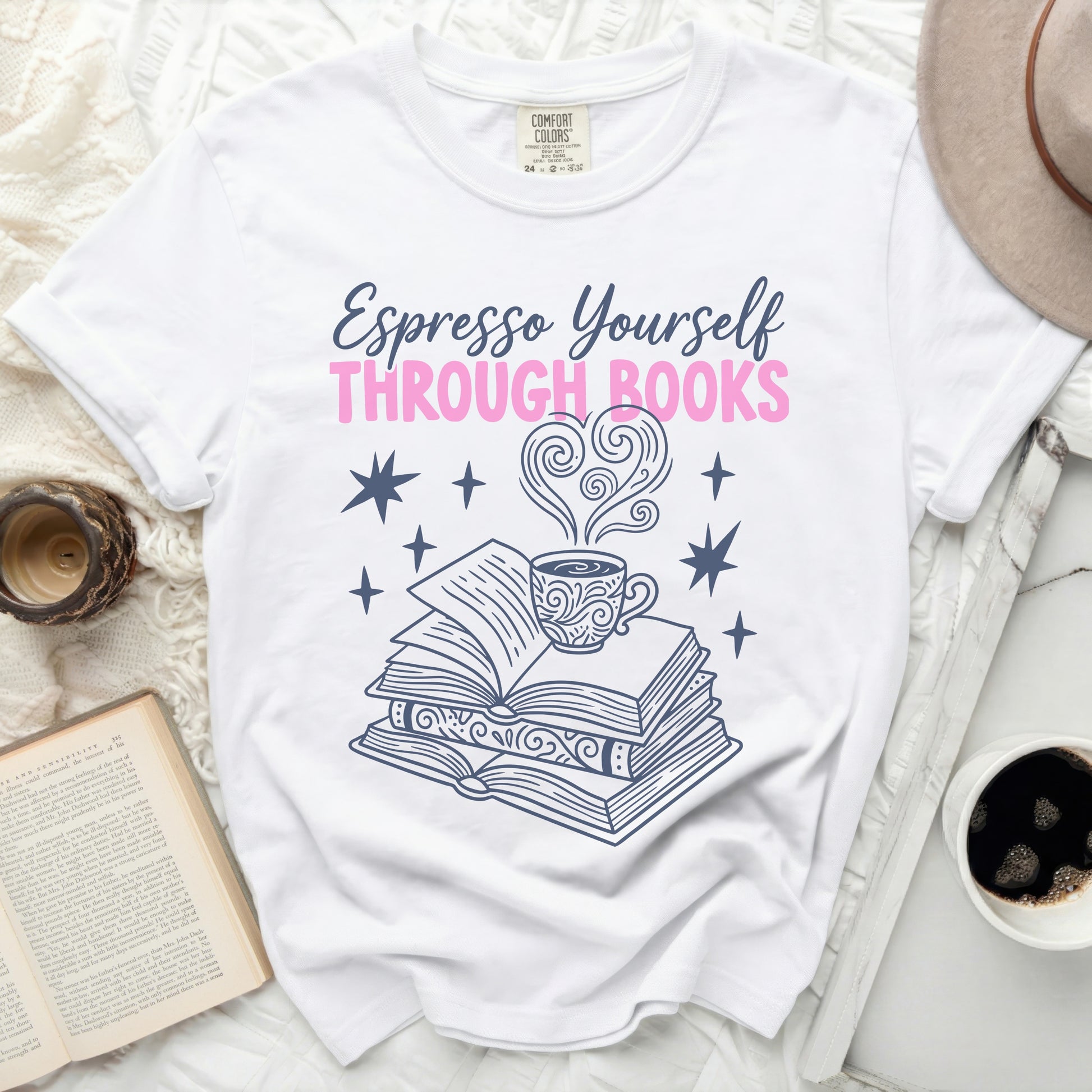 White t-shirt with "Espresso Yourself Through Books" text and stacked books.