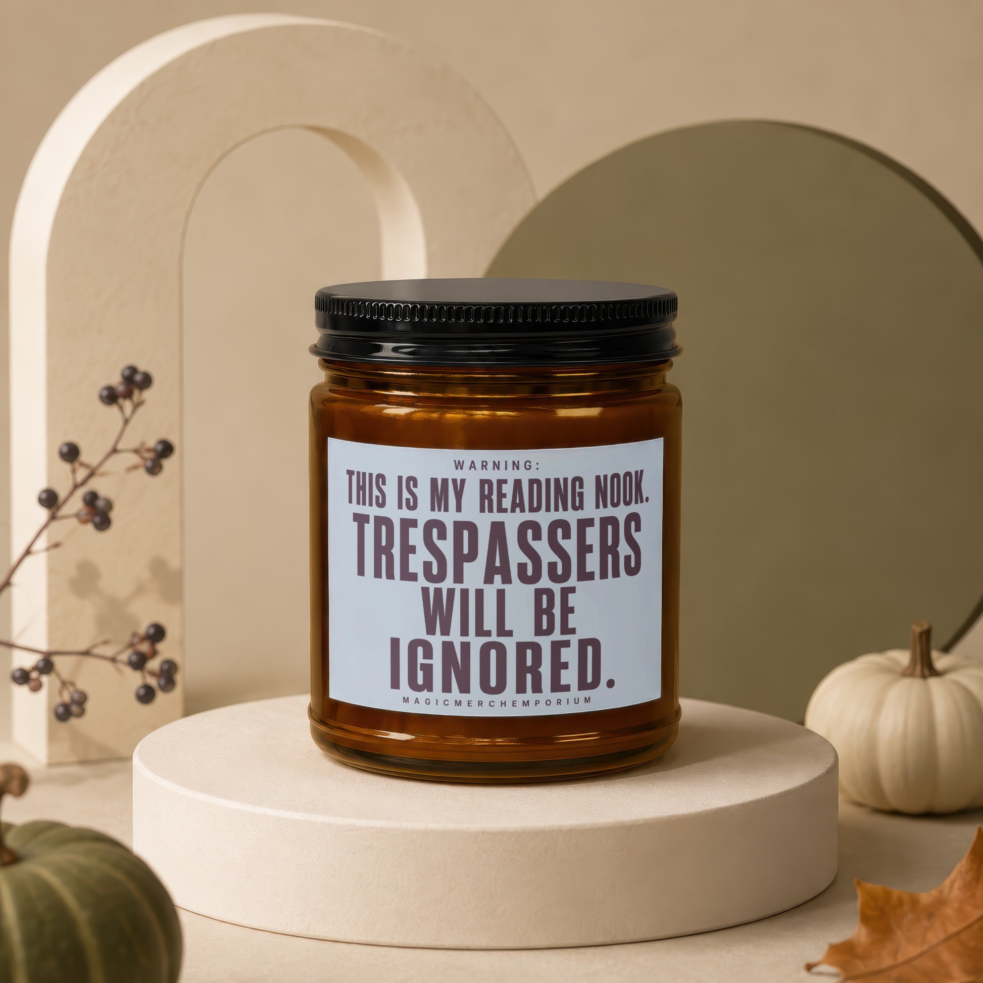 Amber jar candle with "TRESPASSERS WILL BE IGNORED" text.