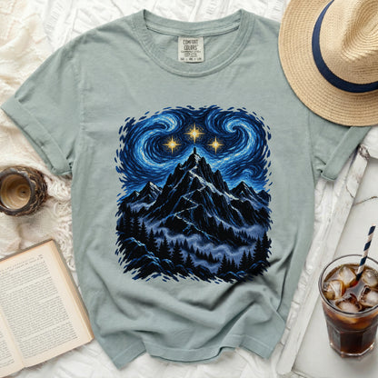 T-shirt with a starry night mountain graphic and Comfort Colors tag.