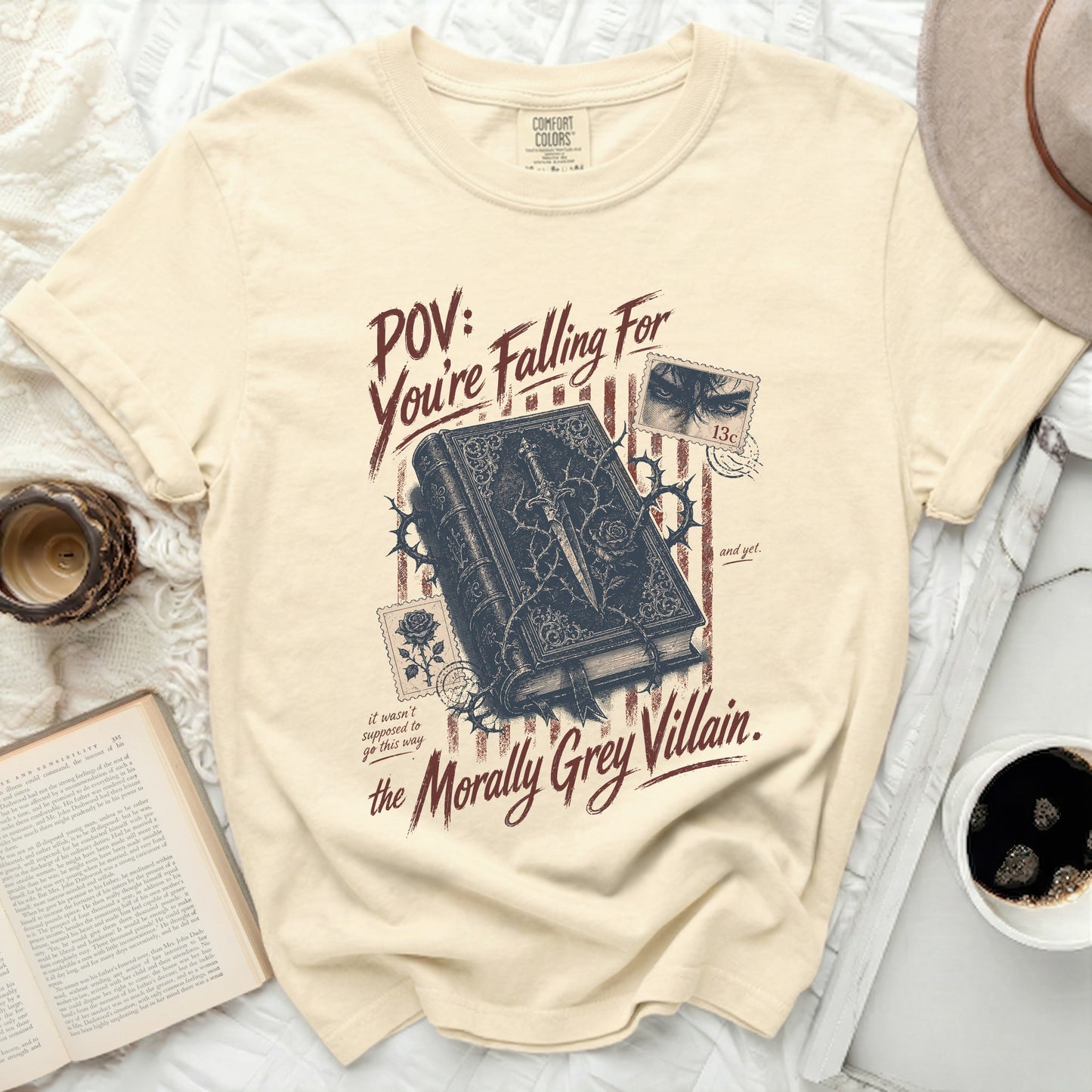 Cream t-shirt with "POV: You're Falling For the Morally Grey Villain" text.