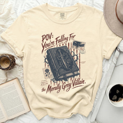 Cream t-shirt with "POV: You're Falling For the Morally Grey Villain" text.