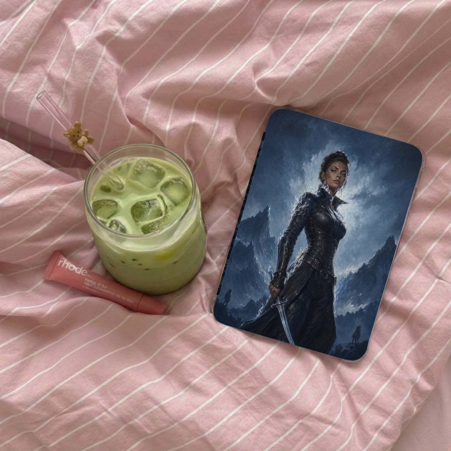Iphone case with fantasy warrior artwork and a matcha drink.