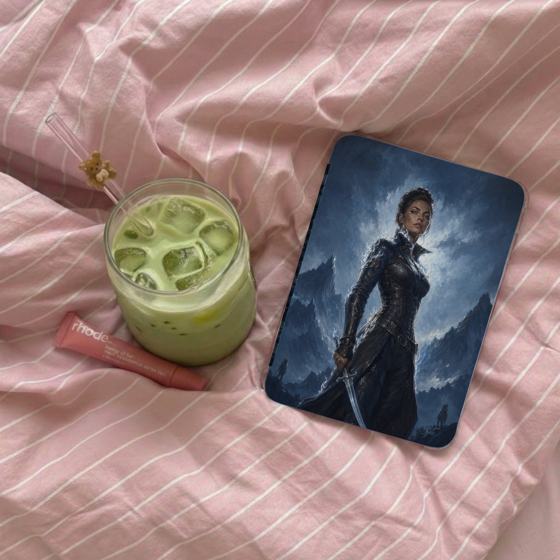 Iphone case with fantasy warrior artwork and a matcha drink.