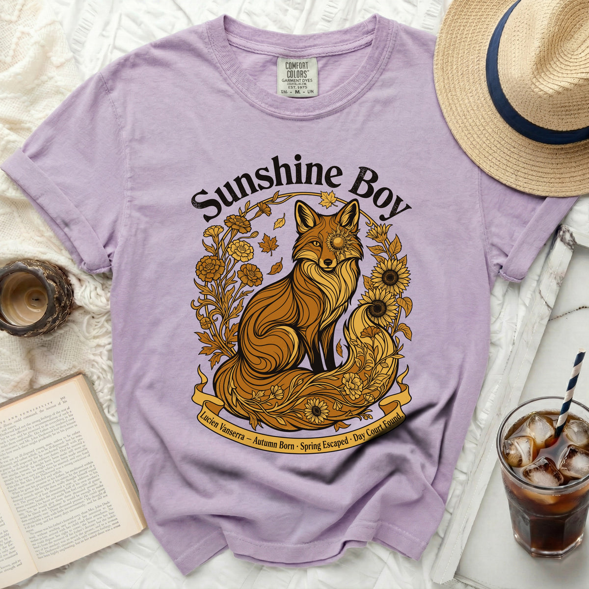 Lavender t-shirt with "Sunshine Boy" text and a fox illustration surrounded by flowers and leaves.