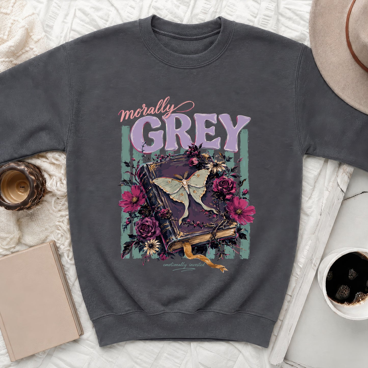 Dark gray sweatshirt with "morally GREY" text over an open book with a moth and flowers.