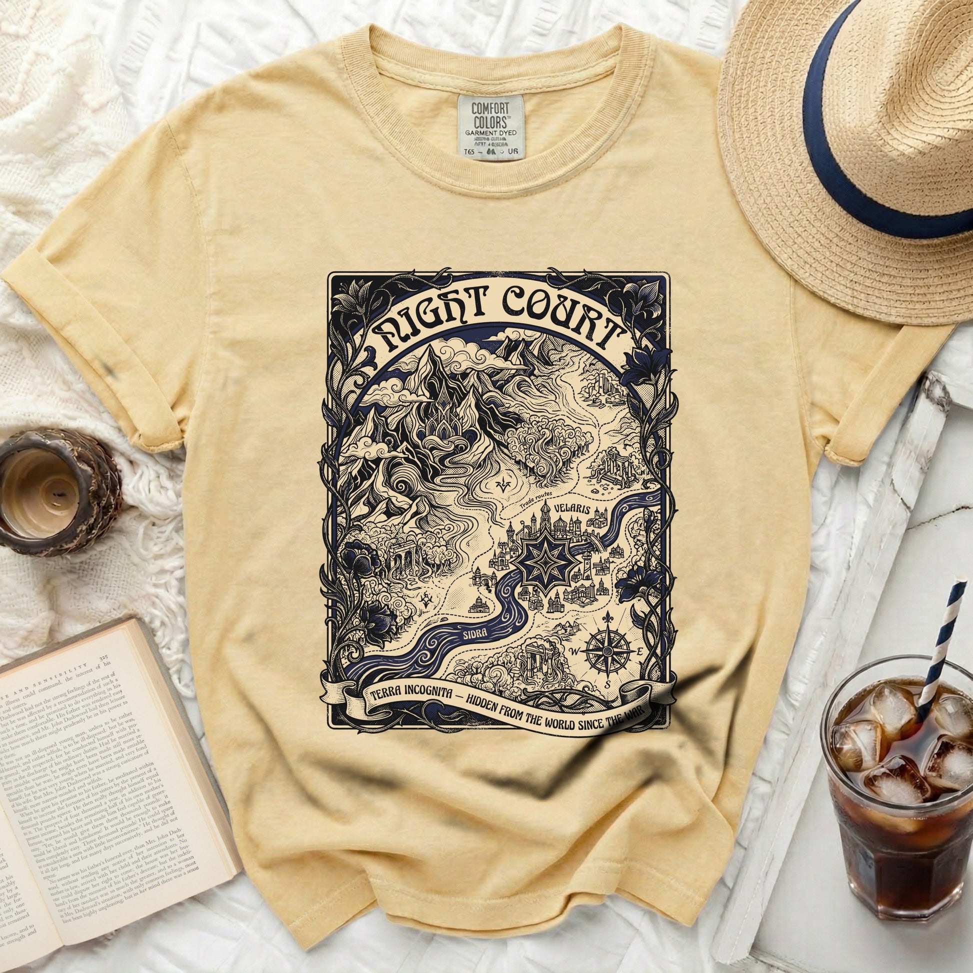 Yellow t-shirt with a map design featuring "Night Court" text and "Terra Incognita".