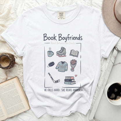 White t-shirt with "Book Boyfriends" graphic and illustrations of reading and hobbies.
