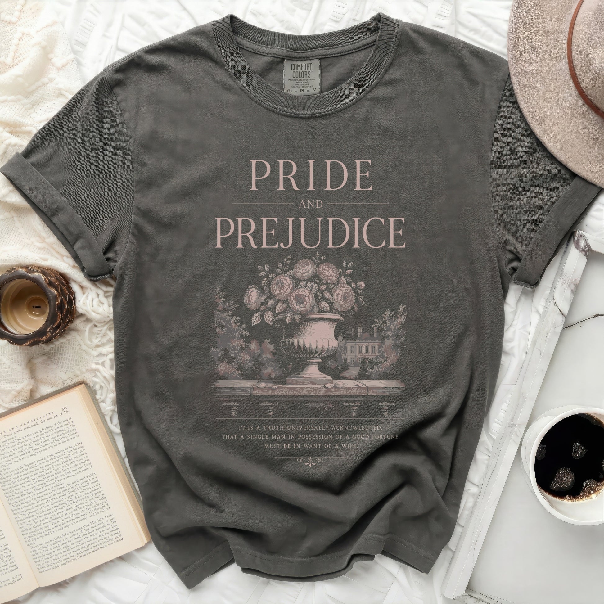 Pride and Prejudice graphic t-shirt with ornate floral vase and manor scene.