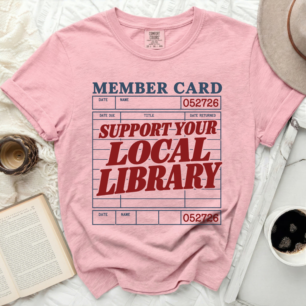 Pink t-shirt with "MEMBER CARD" and "SUPPORT YOUR LOCAL LIBRARY" text.