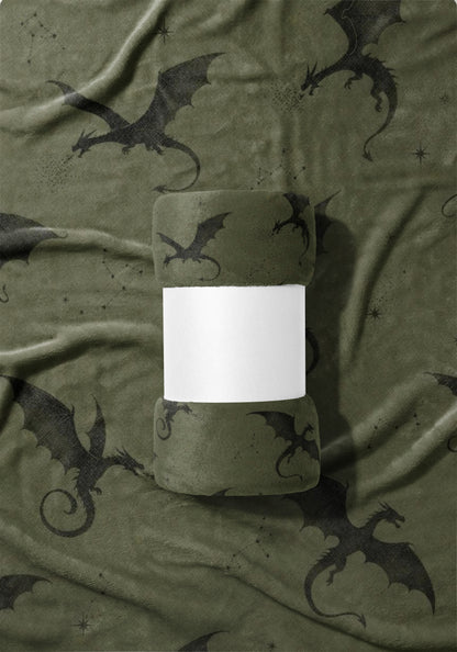 Olive green blanket with dark gray dragons and constellations pattern.