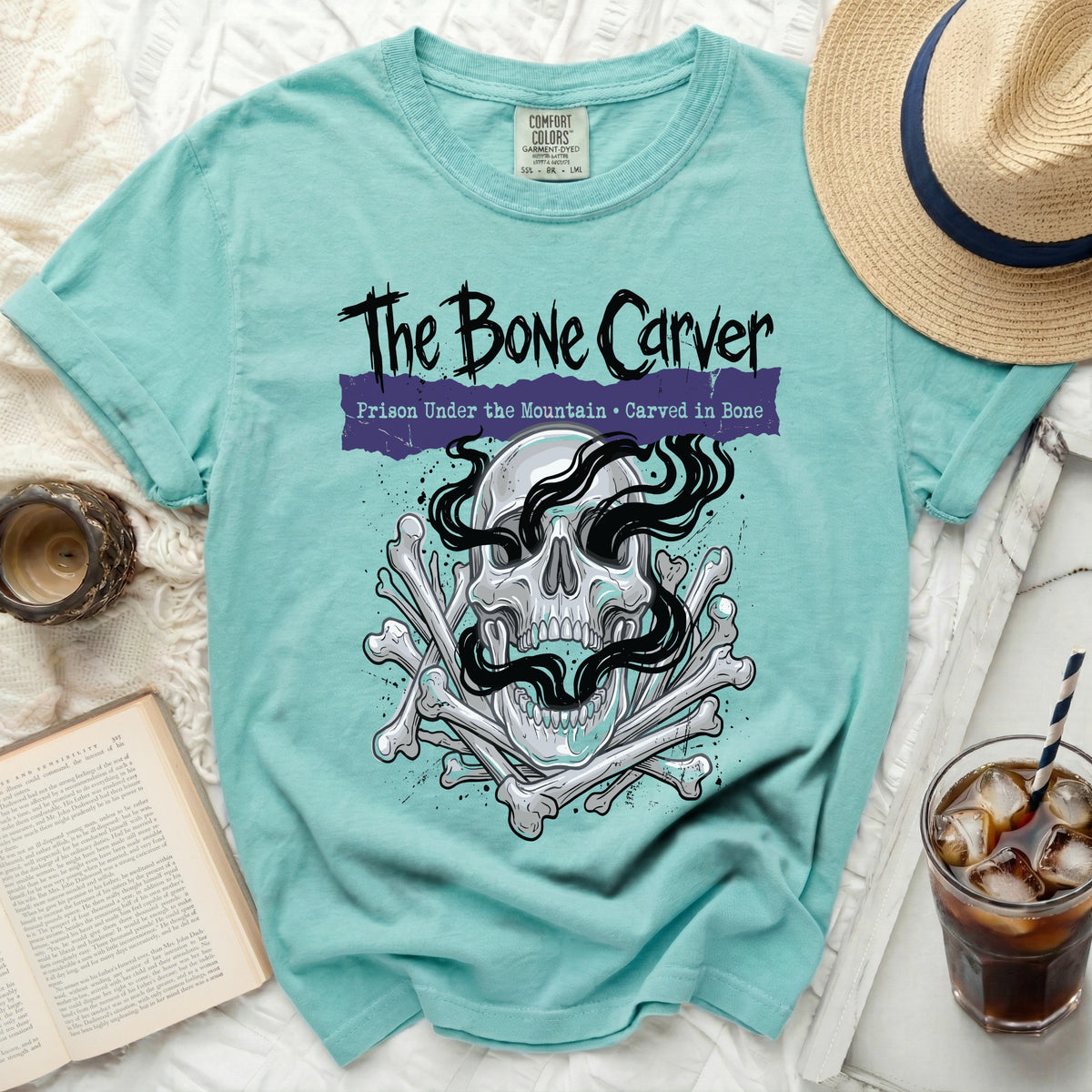 The Bone Carver t-shirt with skull, bones, and text.