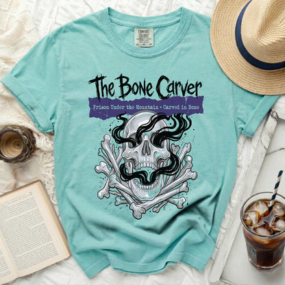 The Bone Carver t-shirt with skull, bones, and text.